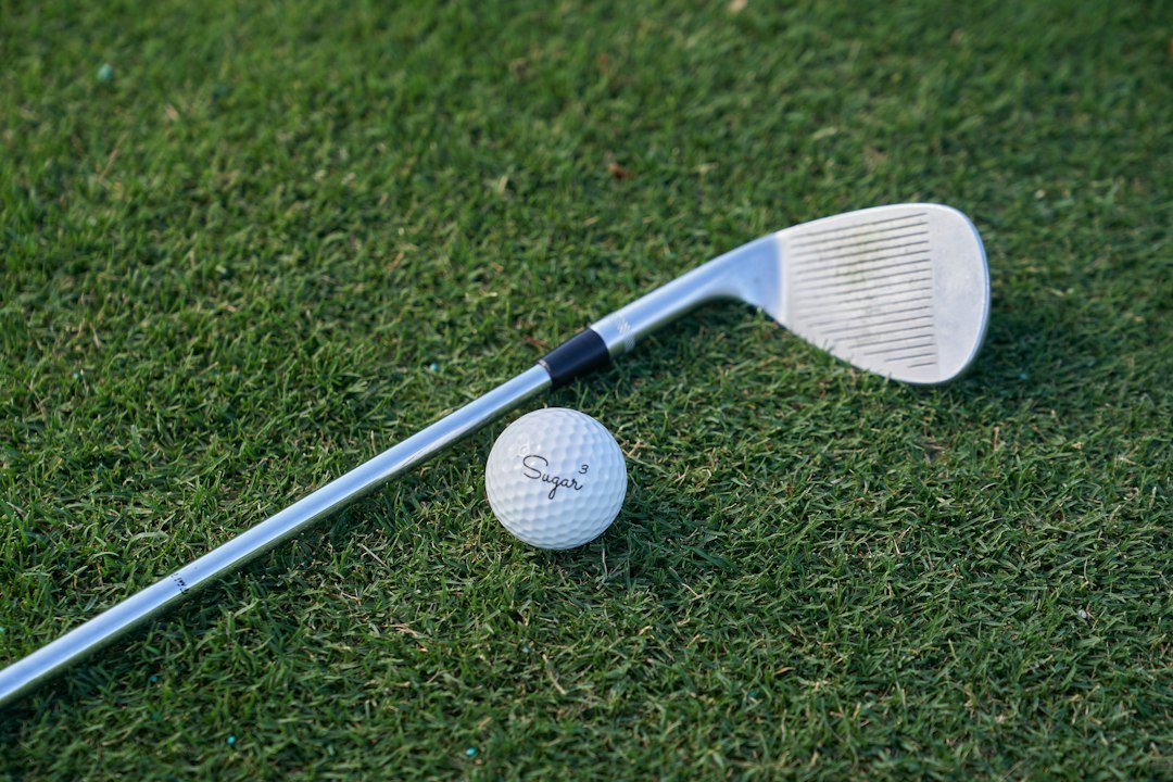 white golf club on green grass field